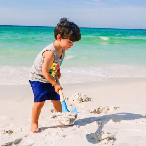 one of the best beach hacks for toddlers is not to bring too many sand toys.