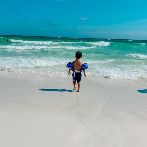 one of my best beach hacks for toddlers is to put floaties on toddlers.
