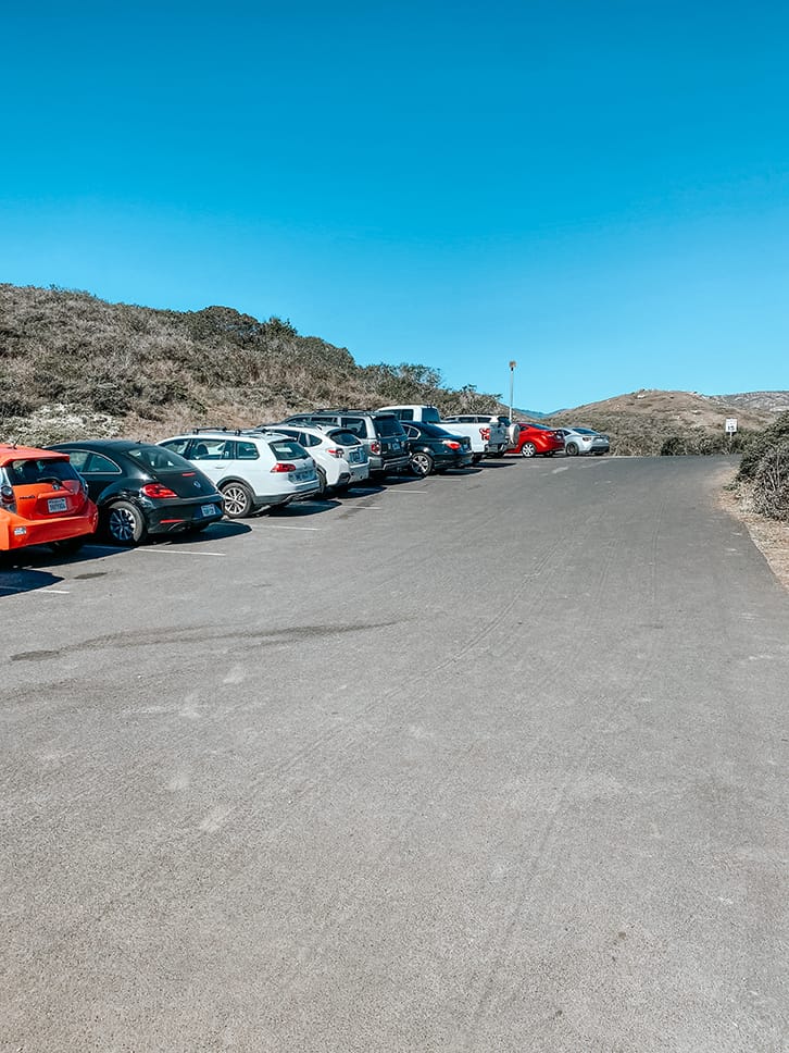 parking lot at californias black sand beach with kids