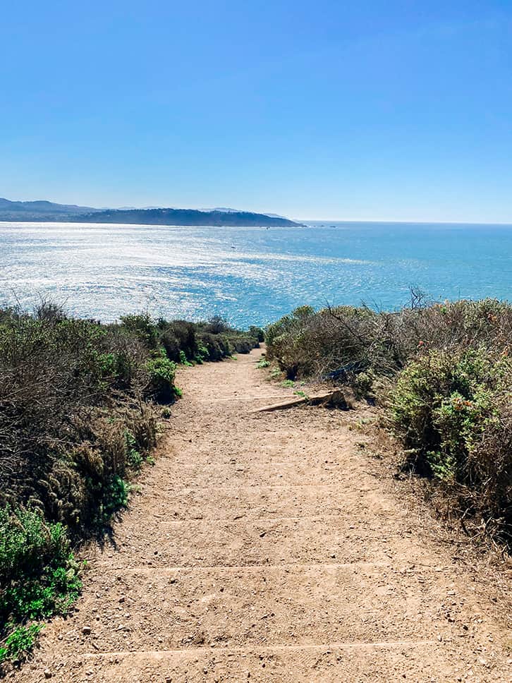 walk down to the black sand beach
