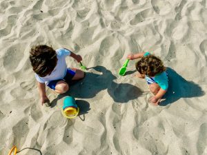 one of my best beach hacks for toddlers is to not pack too much stuff.