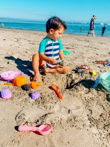 one of the best baby beach essentials is sand toys